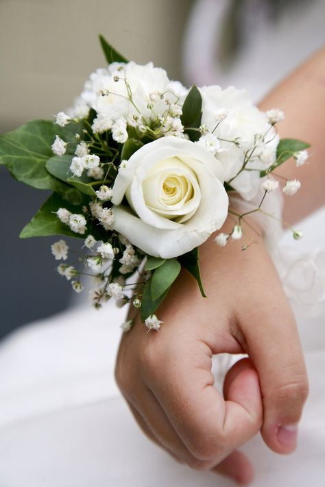 Our wrist corsages for the flower girls Mom Corsage Wedding, White Corsage Wedding Mothers, White Rose Wrist Corsage Wedding, Bridal Corsage Wrist The Bride, Mother Of Bride Corsage Wristlets, Mother Of Bride Wrist Corsage, Mothers Corsages For Wedding, White Rose Corsage Wrist, Wrist Corsage Wedding Mothers