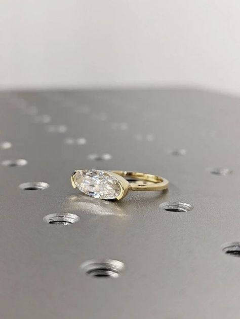 East West Oval Moissanite half bezel set Solitaire Engagement Ring ,14k Yellow Gold Elongated Moissanite Wedding Ring, Moissanite Solitaire Center BRAVERMAN Moissanite Cut : Oval Shape Cut Total Carat : 2.2CT Color : D Clarity : VVS #14k #yellow #gold #diamond #ring #east #west #oval #ring #jewelry #moissanite #oval #cut #moissanite #oval #ring #oval #moissanite #wedding #ring #half #bezel #ring #engagement #ring #oval #solitaire #promise #ring #oval #cut #ring Moval Engagement Ring, Half Bezel Setting, Half Bezel, Bezel Engagement Ring, Baguette Ring, Solitaire Setting, Oval Moissanite, Bezel Ring, Ring Moissanite