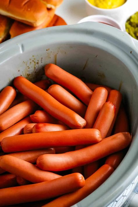 How to cook easy Crock Pot hot dogs with the best flavor. Great make-ahead recipe that you can use to set up the ultimate hot dog bar with all of your favorite toppings to serve at your next summer potluck or backyard BBQ! Crock Pot Hot Dogs, Crockpot Hotdogs, Homemade Chili Cheese Fries, Boiled Hot Dogs, Cook For A Crowd, Making Hot Dogs, Grilling Hot Dogs, Hot Dog Toppings, Chili Cheese Dogs