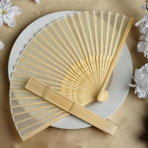 Keep your guests cool during the wedding with our Asian Silk Folding Fans at efavormart.com. Wholesale rates of unique party favors and decorations under one roof. Fan Wedding Favors, Hand Fans For Wedding, Folding Fans, Creative Wedding Favors, Inexpensive Wedding Favors, Wedding Favors And Gifts, Key Bottle Opener, Cheap Favors, Unique Party Favors