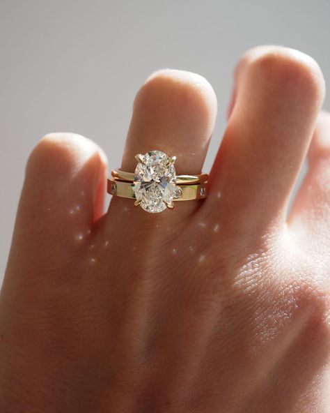 Kate & Kole | The perfect pairing — Our Clara 3.09ct Oval Solitaire Engagement Ring paired perfectly alongside our newest addition to our Wedding Band… | Instagram Thick Gold Wedding Band, Thick Band Engagement Ring, Thick Wedding Bands, Gold Oval Engagement Ring, Gold Band Engagement Rings, خواتم خطوبة, Oval Solitaire Engagement Ring, Dream Wedding Ring, Pretty Engagement Rings