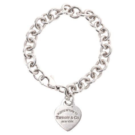 Tiffany & Co Sterling Silver Return To Tiffany Heart Tag Bracelet Chunky link chain with silver heart-shaped tag having 'Tiffany & Co 925' engraved to one side. Lobster clasp closure. Rrp Approx. £600 Size - One Size Condition - Vintage - Good/Very Good (Scratches to the heart) Composition - Sterling Silver Comes With - Original Box & Dust Bag Original Packaging Condition - Very Good Tiffany And Co Bracelet Silver, Heart Chain Bracelet, Tiffany Bracelet, Tiffany And Co Bracelet, Return To Tiffany, Silver Heart Bracelet, Diamond Tennis Necklace, Modern Bracelets, How I Wish