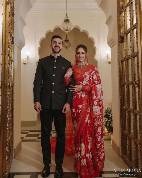 This couple nailed the reception look like a pro ♥️ Swipe to see the stunning wedding reception photos and don't miss to see the last picture😍❤ Gorgeous Bride: @jaislinchona Handsome Groom : @gurrajsingh037 MUA: @makeupbysahibachona Hair: @hairbydablu Saree: @taruntahiliani Jewelry: @sunita_shekhawat_jaipur Photographer: @nitinaroraphotography Event Planner: @rudraevent Decor: @weddinglightsevents #redsaree #reception #weddingreception #indianweddingreception #receptionbride #sare... Indian Groom Bride Outfit, Bride In Saree And Groom In Suit, Indian Wedding Outfits Bride And Groom, Reception Dress Indian Couple, Wedding Reception Look Indian Bride, Indian Reception Couple Outfit, Indian Reception Outfit Groom, Bride Reception Saree Look, Reception Outfit For Groom Indian