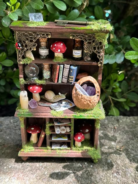 One of a kind fairy hutch - each hutch is a little work of art and contains its own special items.  Measures about 6.5 inches tall and 4 inches wide.  Each hutch I create is hand painted, has a crystal ball with a moving pattern, has hand created items, attention to detail,  contains real crystals/stones, are made with love and a little fairy magic. Fantasy Furniture Diy, Fairy Furniture Diy, Fairy Cottage Aesthetic, Fairy House Ideas, Mushroom Furniture, Fairy Doll House, Mushroom Stuff, Fairy Items, Fairy Dollhouse