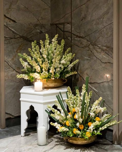 This entrance is a perfect combination of traditional splendour and elegance. We used a foliage of Rajnigandha, bright sunflowers, Marigold, Birds of Paradise and Sevanti flowers in brass and ceramic pots to create this look. . . . Decor - @wedfieldevents Entertainment- @wedfieldevents Photography -@wedfieldphotography . . #wedfield #destinationweddings #destinationwedding #decor #luxurywedding #weddingmoments #WeddingDecorTrends #WeddingDecorLove #WeddingFurniture #WeddingStyle #day... Rajnigandha Flower Decor, Marigold Decor, Couple Seating, Ganpati Decoration Theme, Night Wedding Decor, Decoration Theme, Indian Theme, Desi Wedding Decor, Diwali Decor