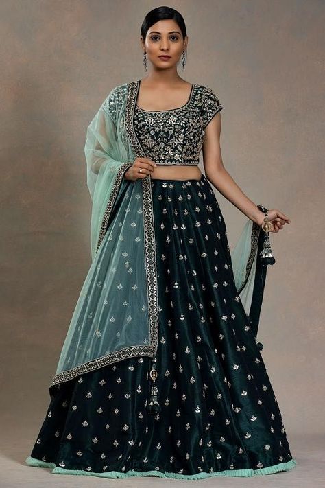 Give a style statement with your lehenga attire by adorning this sea green colored raw lehenga and matching readymade choli, mint green color net dupatta for your engagement event. It is enriched with intricate gota, dori, bead and sequins embroidery. Style the outfit with contemporary jewelery or if you're wearing it for haldi you can accentuate by wearing floral jewlery which is quite trending. There might be a little color variation in the image and original product due to photographic lighti Navy Blue Wedding Lehenga, Navy Blue Blouse Designs For Lehenga, Blue Lehenga Contrast Blouse, Navy Blue Lehenga Color Combinations, Blue Satin Lehenga, Blue Wedding Lehenga, Wedding Half Saree, Satin Lehenga Choli, Lehenga Purple