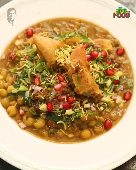 Tawa Samosa Chaat | samosa, street food, chaat | Over The Top deliciousness! Samosa and ragda come together to make scrumptious street food. Sunke hi bhook lagi na?😋 #StreetFoodIndia | By Sanjeev Kapoor Chaat Samosa, Samosa Chat, Samosa Chaat, Sanjeev Kapoor, Chaat Recipe, Buddha Image, Samosa, Over The Top, Come Together