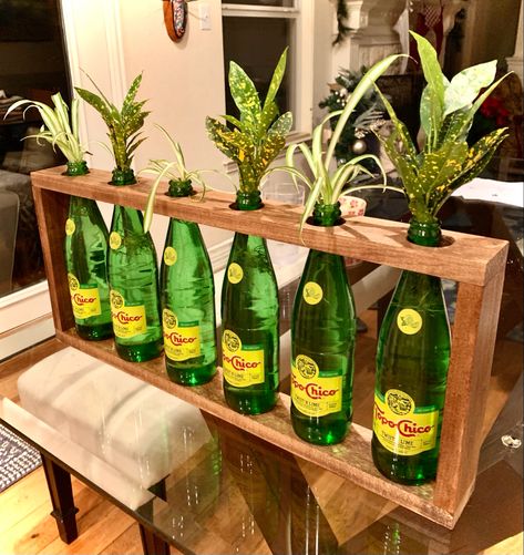 Diy recycled topo chico bottle centerpeice Topo Chico Bottles Crafts, Diy Bottle Decor, Ranch Art, Wine Bottle Table, Recycled Diy, Mermaid Pose, Old Glass Bottles, Art 2023, Glass Bottle Diy