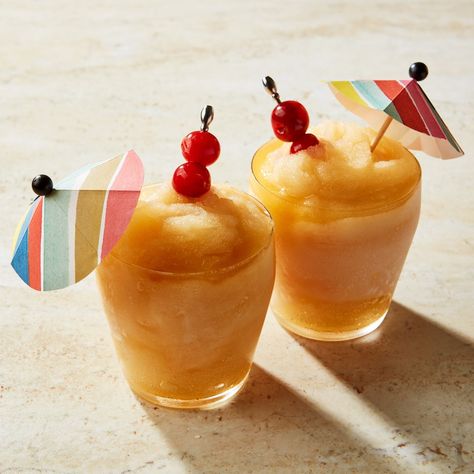 Amaretto Sour Slushy Recipe | Epicurious Frozen Cocktail Recipes, Amaretto Sour, Cocktail Umbrellas, Frozen Cocktails, Brain Freeze, Easy Cocktails, Frozen Drinks, Cocktail Making, Slushies