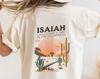 This unisex Boho Christian t-shirt features a beautiful design that showcases Isaiah 43:19 bible verse. With a soft and comfortable fabric, this tee is perfect for casual wear, whether you're at church, a Christian concert, shopping or sipping your favorite beverage and just while hanging with your friends. Rolled sleeves in picture is for styling purposes only. Printed on Cotton Bella and Canvas and Comfort Colors T-shirts (see colors in listing). Make it an Oversized Tee. Unisex T Shirt Design, What To Wear To A Christian Concert, Jesus Tshirt Design, Oversized T-shirt, Christian Shirt Ideas, Christian Tshirt Design Ideas, Printing On Tshirt, Trendy T Shirt Designs, Jesus T Shirts