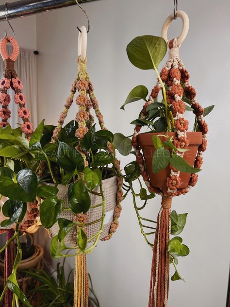 These beautiful flower plant hangers are the perfect bohemian touch to any space! Choose from over 30 colors to express your creativity or to match any room in your home. I handcraft each plant hanger with love and meticulous detail. (Seriously, I have OCD when it comes to making sure everything is perfect) When ordering please specify what color you want for the stem, center and flower. You have a choice of two sizes:** The flowers are made very tightly to keep them from stretching out over tim Macrame Plant Hanger Display, Colorful Macrame Plant Hanger, Macrame Loop, Everything Is Perfect, Macrame Wall Hanging Diy, Macrame Hanger, Wall Hanging Diy, Plant Hangers, Wooden Ring