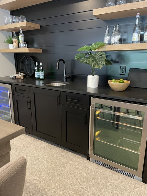 Black Shiplap Bar Wall, Basement Kitchenette Black Cabinets, Black Cabinets Bar Area, Bar Feature Wall Design, Black Cabinets In Basement, Black Wet Bar Cabinets, Shiplap Wet Bar, Black Basement Bar Cabinets, Basement Bar With Floating Shelves