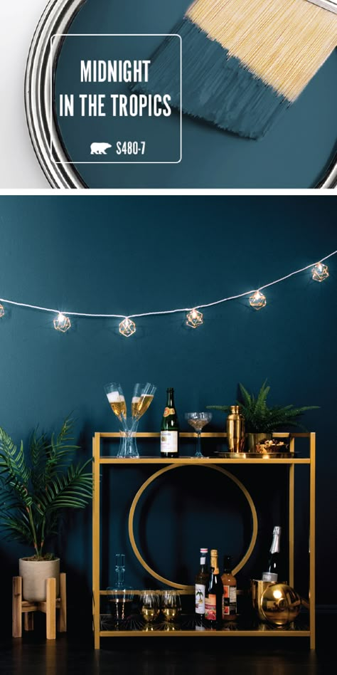 Kick 2018 off on a stylish note with the dark blue hue of Midnight In The Tropics by BEHR Paint. This deep shade of navy adds a bold, sophisticated style to the interior design of your home. A retro gold bar cart and string lights are all you need to recreate this elegant New Year’s Eve party set-up in your living room. Check out the full article for more home decor inspiration. Wall Colours, Barn Apartment, Behr Paint, Cute Dorm Rooms, Bohol, Home Cinema, Pretty Colors, Paint Colours, Cool Ideas