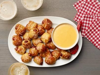 Biscuit Pretzel Bites with Hot Dogs and Nacho Cheese Dipping Sauce Recipe | Food Network Kitchen | Food Network Biscuit Pretzel Bites, Gathering Recipes, Cheese Dipping Sauce, Canned Biscuit, Smoked Cocktails, Cocktail Sausages, Festive Appetizers, Quick Dip, Nacho Cheese Sauce