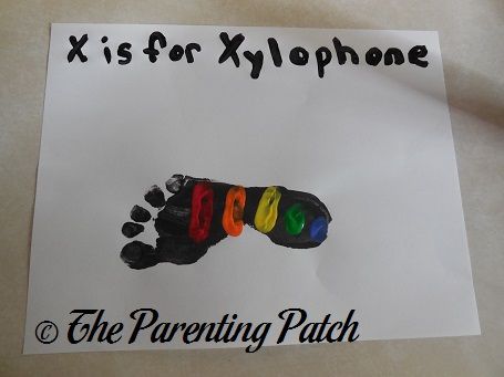 X Is for Xylophone Footprint Craft | Parenting Patch Xylophone Footprint Craft, Music Footprint Art, D Footprint Craft, Letter C Footprint Craft, Letter F Footprint Craft, Music Crafts For Infants, Infant Alphabet Art, Q Is For Handprint Craft, X Is For Craft