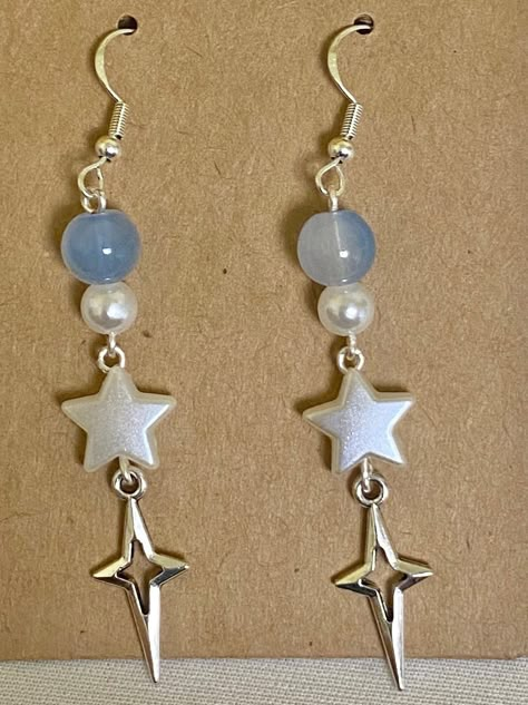 🌠a pair of y2k light blue dangle earrings 🪩handmade with love and packaged with care :D earrings backs and freebie stickers included 🤍thanks for visiting my shop Silver Y2k Earrings, Diy Blue Earrings, Star Bead Earrings, Homemade Earring Ideas, Easy Jewelry Diy, Homemade Jewelry Ideas, Etsy Jewelry Necklace, Y2k Light Blue, Freebie Stickers