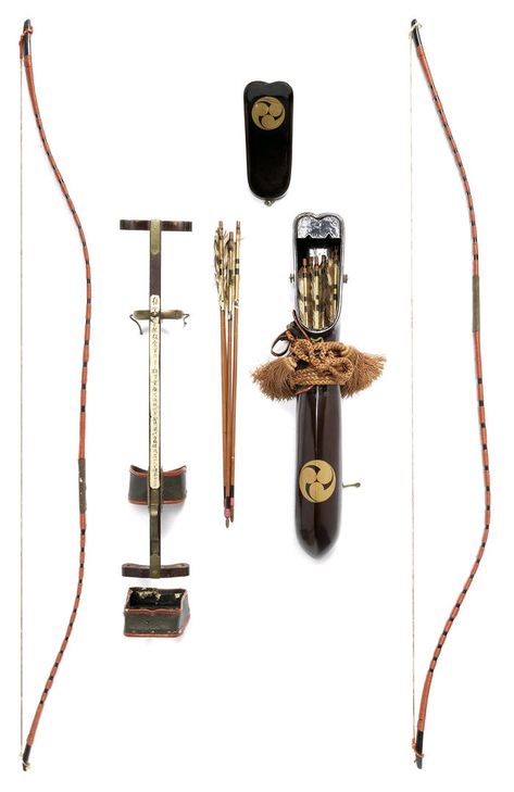 A pair of yumi (bows), a yazutsu (enclosed arrow-quiver) and an ebira (quiver) 19th century. The bows of black lacquer bound with red-lacquered rattan bands, 119.5cm (47in); the yazutsu of roiro, lacquered in gold hiramakie with mitsu-tomoe mon... Archery Stand, Yumi Bow, Bows And Arrows, Toshiro Mifune, Arrow Quiver, Traditional Archery, Japanese Warrior, Samurai Armor, Uchiha Sasuke