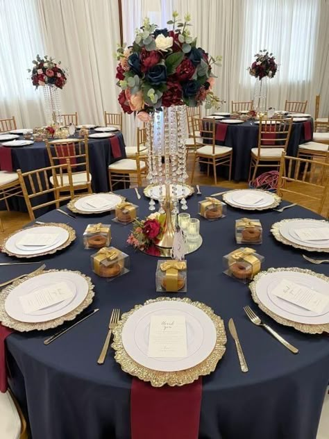 Navy Blue Burgundy And Gold Wedding, Gold Plate Centerpiece, Navy Blue Red And Gold Wedding Table Settings, Burgundy And Navy Reception Decor, Navy Tablecloth Wedding Round Tables, Navy Burgundy Gold Wedding Centerpieces, Navy Blue Burgundy Wedding Decorations, Navy Blue Burgundy Gold Wedding Tables, Navy Blue And Burgundy Wedding Reception Tables