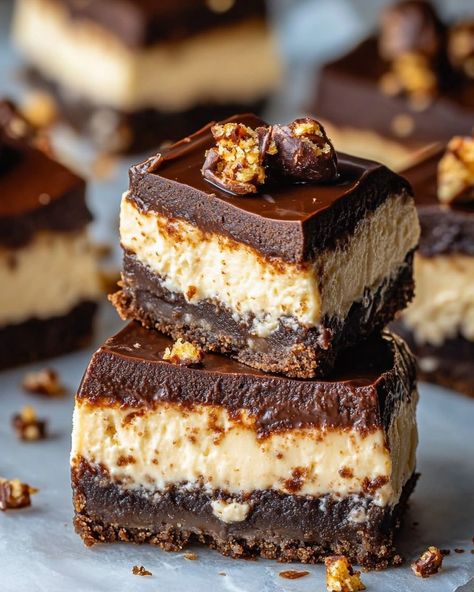 The recipe title is: Brownie Bottom Snickers Cheesecakes Loaded Brownies, Snickers Cheesecake, Cheesecake Layer, Snickers Bar, Fun Size, Brownie Mix, Decadent Desserts, Powdered Sugar, Food Cravings