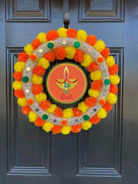 Main Door Diwali Decoration Ideas Simple, Pom Pom Rangoli Designs, Diwali Wreath Ideas, Diwali Door Decoration Ideas, Deepavali 2024, Diwali Wreath, Diwali Hangings, Wool Crafts Diy, Diwali Design