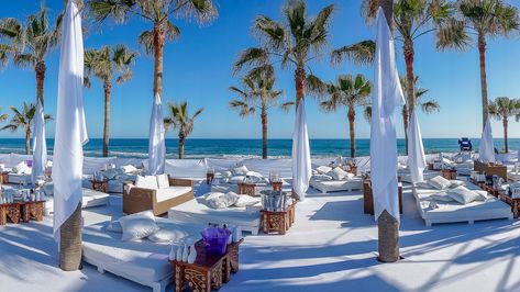 Nikki Beach Marbella, Spain beach club, Nikki Beach's Marbella outpost offers white day-beds, plenty of palm-trees, open-air fine-dining, live music and DJs in its outdoor restaurant. Nikki Beach Marbella, برج العرب, Nikki Beach, Marbella Spain, Beaches In The World, Beach Bars, Most Beautiful Beaches, Marbella, Vacation Destinations