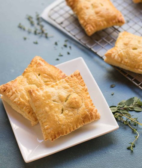 Handheld Chicken Pot Pie Envelopes - the perfect hearty nibble to serve to friends and family while watching sports and other events on TV! All the comfort food flavors in chicken pot pie, but folded inside a puff pastry envelope, making it easy to serve these make ahead delights as finger food. #chickenpotpierecipes #handheldpierecipes #savorypies #footballfood #gamedayrecipes Chicken Pot Pie Pockets, Pot Pie Pockets, Pie Pockets, Chicken Pot Pies, Mini Chicken Pot Pies, Pot Pie Filling, Main Entrees, Wolfgang Puck, Savory Pies