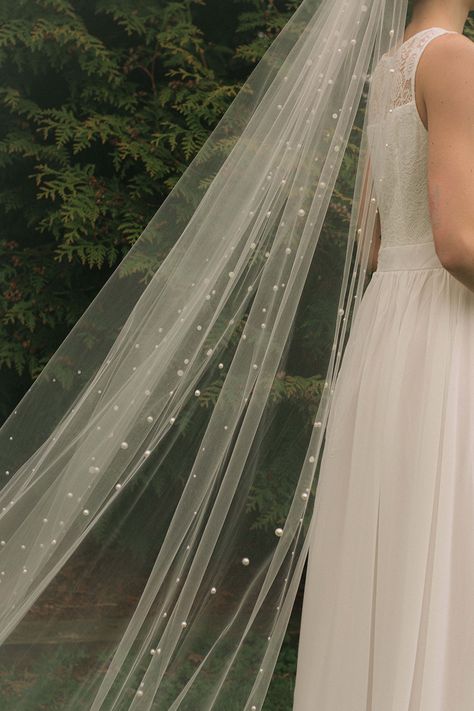 Veils have a long and rich history in matrimonial tradition. Once worn in Roman times to ward off spirits that might thwart happiness for the bride and newlyweds. Sometimes worn as a symbol of purity and innocence, lifted only for her husband-to-be at the altar. A beautiful and poignant moment for both bride and groom. Veils add mystique and beauty to a bride on her wedding day. Pearl Vale, Pearl Veil, Lisa Design, Head Pieces, Cathedral Veil, Ivory Pearl, Innovative Design, Half Moon, Wedding Inspo