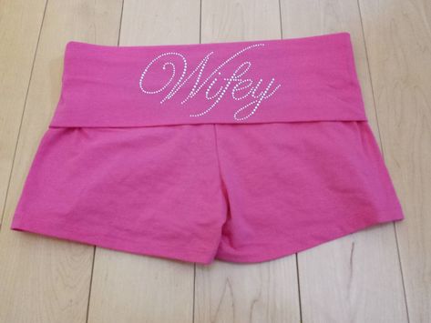 "This listing is for customized Fold Over Short Shorts with custom \"Wifey\" rhinestones.    These shorts are available in black, pink, charcoal and white. Please specify which you prefer :)  I also offer  Wifey in clear, pink or blue Bride in clear, pink or blue and clear bold font Bride to Be Maid of Honor  Matron of Honor Jr. Bridesmaid Flower Girl Just Married in clear and clear with pink Bridesmaid in clear or blue Brides Entourage  The inseam of these shorts is 2\" They are 95% cotton and 5% spandex.  The rhinestones are clear and placed on the fold over portion on the back of the shorts.    Great item for a the bride to get ready in or a gift for the wedding shower.  If you are interested in purchasing more than one please contact us and we will get sizes and send you an invoice :). Fold Over Shorts, Rhinestone Shorts, Short Rosa, Jr Bridesmaid, Short Bride, Blue Bride, Short Blanc, Bridesmaid Flower, 2000s Fashion Outfits