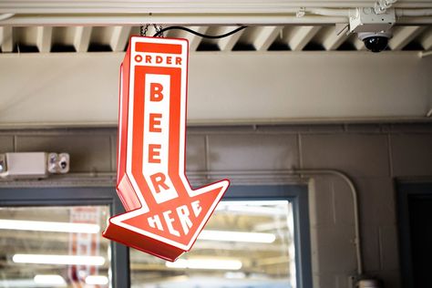 Environmental Design: Immersive Brand Experiences - Craft Beer Branding Guide by CODO Design Industrial Typography, Arrow Signage, Benton Harbor Michigan, Wayfinding Signs, Benton Harbor, Beer Shop, Exterior Signage, Environmental Graphic Design, Wayfinding Signage