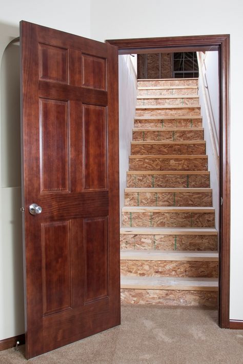 Doors to stairwells help with heating and cooling of spaces. Could be glass door to help keep feel open and transmit light. Door At Bottom Of Stairs, Stairs Attic, Cam Jansen, Attic Design Ideas, Attic Door, Attic Rooms Ideas, Basement Staircase, Open Basement, Attic Bedroom Storage