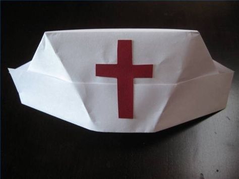 For a fun Halloween costume, the nurse's uniform is one that appears year after year. Nurses no longer wear the recognizable white dress and cap, but the traditional outfit is still a popular costume. You can make your own origami nurse's cap in just a few minutes with some inexpensive supplies.Wear it proudly to all your spooky holiday... Diy Nurse Costume, Halloween Costumes You Can Make, Nurse Crafts, Diy Nursing, Nurse Party, Community Helper, Crazy Hats, Nurse Hat, Nursing Cap