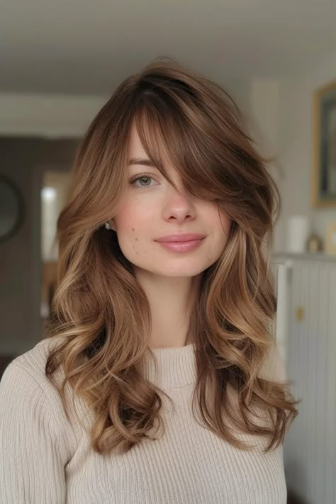 Discover 22 side bangs hairstyles that flatter every face shape. Save this pin to find your perfect look, from elegant sweeps to bold fringes! Side Fringe Mid Length Hair, Long Layered Haircuts For Thick Hair Side Bangs, Long Fringe Side Parting, Wedding Hair With Side Bangs, Long Layers With Side Bangs Round Face, Side Bang Wavy Hair, Side Parting Hairstyle, Curtain Bangs Side Part Straight Hair, Low Matienence Haircut