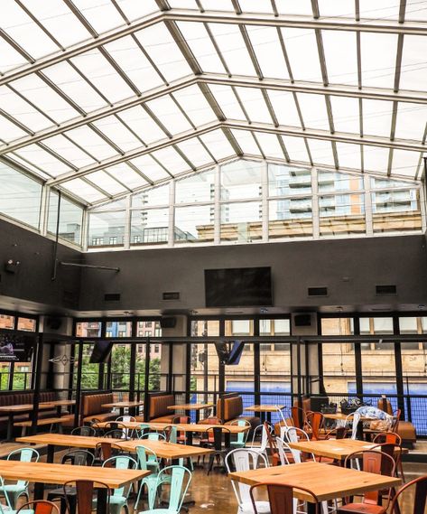 The Roll-A-Cover retractable skylight at Roots Pizza  South Loop in Chicago, IL, allows for year-round dining on the large outdoor rooftop. When the weather becomes inclement, the motorized retractable roof simply closes with the push of a button and still allows for an outdoor ambiance. Views of the sky are never lost and the restaurant never loses revenue due to weather! Retractable Skylight, Retractable Enclosure, Pizza Chicago, Rooftop Restaurant Design, Outdoor Restaurant Design, Residential Pool, Pub Design, Restaurant Patio, Retractable Roof