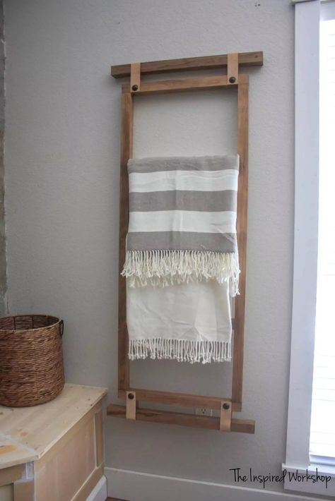 A wall-hanging ladder blanket organizer saves floor space and adds a decorative element. Hang blankets or towels for easy access and visual interest. Its minimalist design fits various bedroom themes, from rustic to modern. Nursery Blanket Display, Blanket Display Ideas, Slat Furniture, Hanging Blanket Ladder, Small Bedroom Organization Ideas, Blanket Display, Bedroom Organization Ideas, Ladder Ideas, Wall Blanket