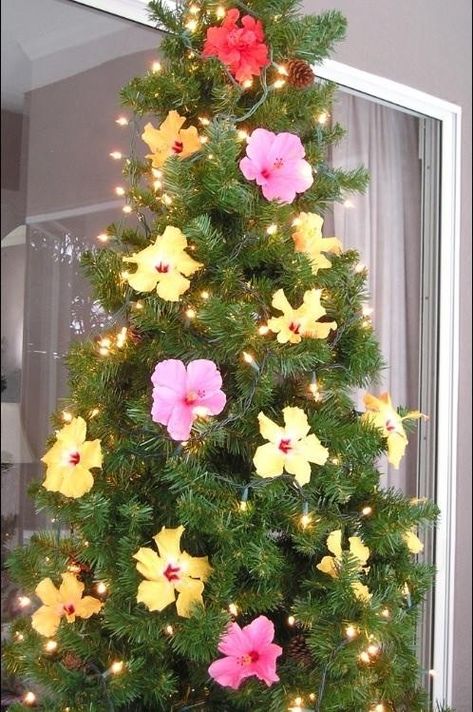 A Hawaiian Christmas Tropical Christmas Tree, Tropical Christmas Decorations, Tropical Christmas Trees, Ward Christmas Party, Rainbow Christmas Tree, Hawaii Christmas, Work Christmas Party, Xmas Theme, Hawaiian Christmas