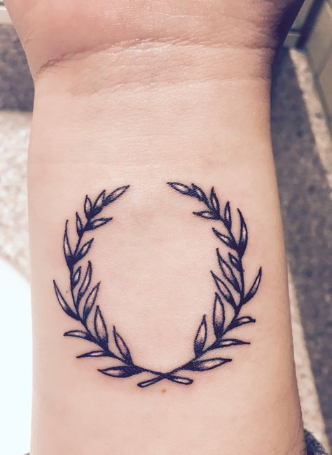 Olive wreath inner wrist tattoo. Meanings: peace, growth, victory. Victory Symbol Tattoo, Victory Tattoo Symbols, Victorious Tattoo, Olive Leaf Tattoo, Victory Tattoo, Nike Tattoo, Laurel Wreath Tattoo, Vines Tattoo, Warrior Symbols