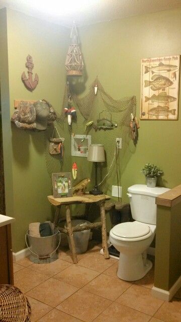 Fisherman's bathroom! Fishing Theme Bathroom, Fishing Bathroom Ideas, Fisherman Cabin, Fish Bathroom Decor, Fishing Bathroom, Fishing Bathroom Decor, Outhouse Ideas, Cabin Decorations, House Ideas Plans