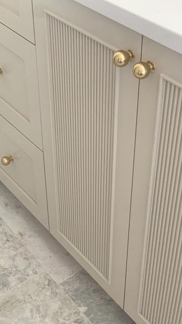 Fluted Vanity Cabinet, Creamy White Bathroom Cabinets, Reeded Cabinets Kitchen, Fluted Built In Cabinets, Spanish Style Bathroom Ideas, Fluted Cabinet Kitchen, Reeded Cabinet Door, Reeded Kitchen Cabinets, Fluted Kitchen Cabinets