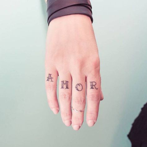 Word ‘AMOR’ inked on the right hand’s fingers Cool Tattoo Designs, Finger Tattoos Words, Amor Tattoo, Portuguese Words, Belly Tattoos, Ribcage Tattoo, Knuckle Tattoos, Finger Tattoo Designs, Cool Tattoo