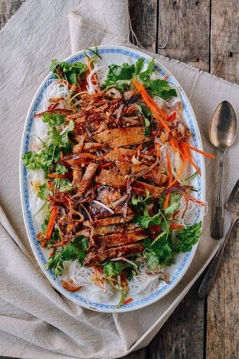 Vietnamese noodle salad with pork chops has fantastic texture and flavor. Add the spicy, garlicky, tangy nuoc cham sauce is the dish is absolute perfection! Vietnamese Noodle Salad, Vietnamese Noodles, Seared Pork Chops, Woks Of Life, The Woks Of Life, Salad Pasta, Grilled Pork Chops, Vietnamese Food, Chops Recipe