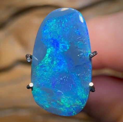 A beautiful, solid Black Opal from Lightning Ridge, New South Wales. Displaying green and blue colouration in broad flash and rolling flash patterns. Cut to a freeform shape. Total weight - 1.8cts Area of Mine - Lightning Ridge, New South Wales, Australia Dimensions - 12.2mm x 7.1mm x 2.9mm Shape - freeform Colours - blue, green Formation - Black Opal Extras - Free International Airmail / shipping automatically applied when purchasing this item and/or bundling with any other purchase.