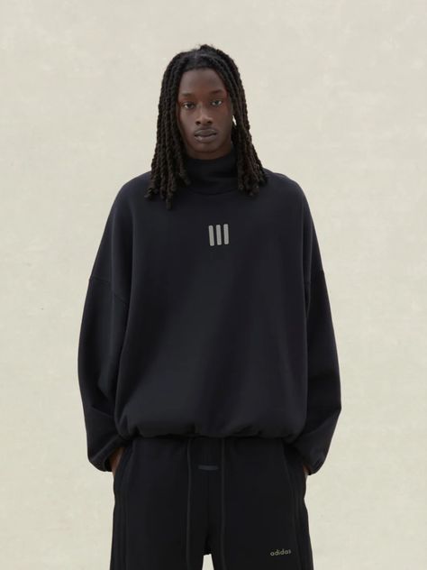 The mockneck hoodie is designed with voluminous proportions in the body and sleeves. Functional details include side seam pockets with a perforated 4-way stretch lining, and an elastic binding frames the hood, sleeve, and waist hem. Diverse branding is realized in a sueded adidas Fear of God logo on the back, a sueded 3-Pillars logo on the center front, and a sueded black bar label on the hood. Fear Of God Logo, God Logo, The Fear Of God, Black Bar, Fear Of God, The Fear, Mens Essentials, Cotton Fleece, Hat Shop