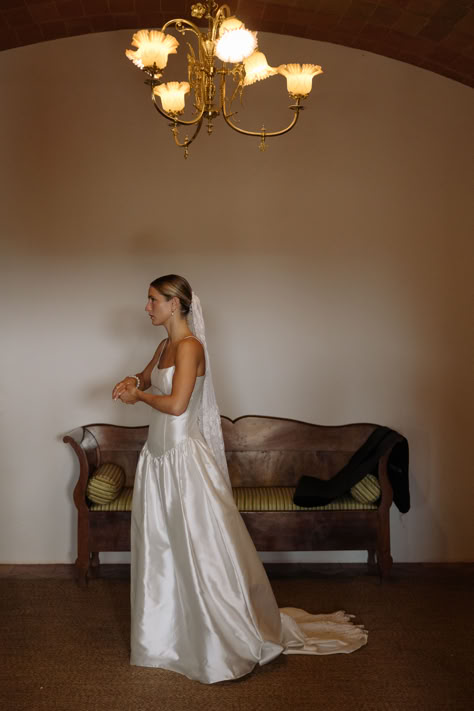 A sun-soaked celebration for Gemma and Jake against the backdrop of Mas Sendra in Spain. For her dress Gemma chose STYLE 075, our beautiful drop waist silk mikado gown with a square neckline and delicate straps. We love Gemma's additional styling touches; customising the back to a lower v and adding a vintage lace veil and pearl hair net, in a nod to her spanish heritage. Read more about this real wedding on the blog. #modernweddingdress #simpleweddingdress #coolbride #bespokeweddingdress V Waist Wedding Dress, Mikado Gown, Real Bridesmaids, Drop Waist Gown, Drop Waist Wedding Dress, Waist Wedding Dress, Girona Spain, Spanish Heritage, Wedding Edit