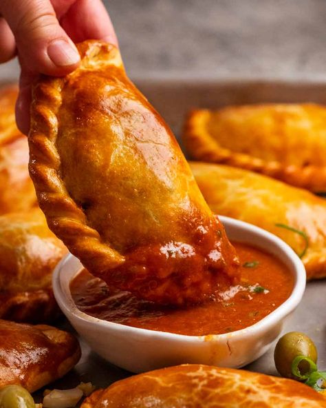 Dipping Beef empanada in sauce Sauce For Empanadas, Empanada Sauce, Homemade Empanadas, Beef Empanadas Recipe, New York Times Cooking, Empanadas Dough, Empanada Recipe, Beef Empanadas, Recipetin Eats