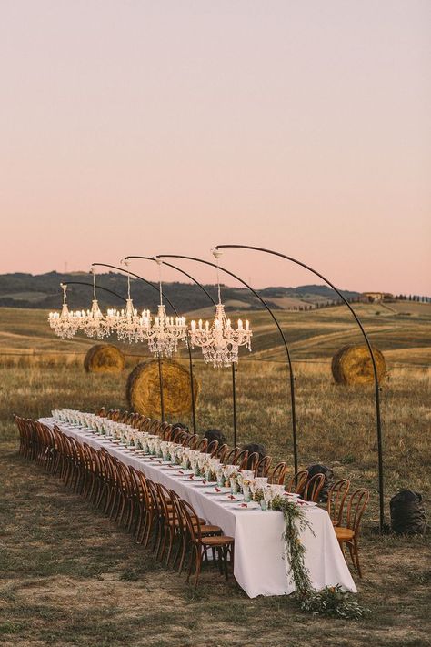 Table with Chandeliers in the Italian Countryside #weddingreceptiondecor #outdoorweddinginspiration #tuscanweddinginspiration Wedding Reception Ideas, Wedding Chandelier, Tuscan Wedding, Italian Countryside, Long Table, Wedding Dinner, Green Wedding Shoes, Italian Wedding, Dreamy Wedding