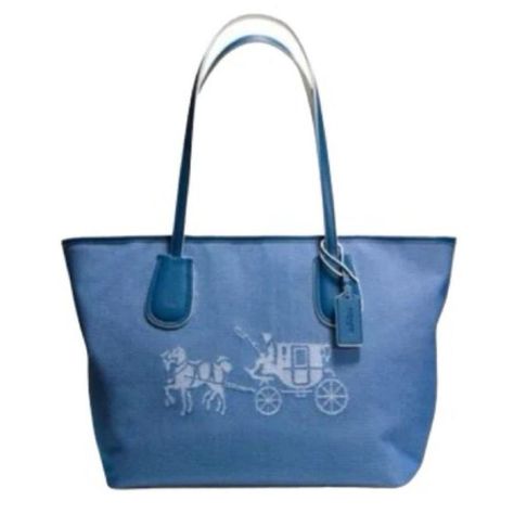 COACH TAXI ZIP TOTE BAG CANVAS DENIM & LEATHER #A1520-35337M INCLUDES COA NWOT BLUE RETAIL $498

Clean all around
17”x10”x6”
Two leather handles, leather trim and tag
Coach dog tag/hang tag
Zip top closure 
Large Stagecoach logo across front 
Inside zip pocket and two slip pockets
Leather bottom has a couple of indents from sitting but that’s it.
Gorgeous blue fabric lining has COACH embossed throughout
Use as large tote or shoulder bag
Sold out online
Includes COA and Twilley Scarf to match (off-branded scarf)

Clean, odor & smoke free
Ships same or next day
Combined shipping available
5 star rated seller
xoxo #The_Tranquil_Loft

Tags: designer, coach, tote, handbag, authentic, vintage, travel, classic, denim, coated, canvas, stagecoach, logo, twilley, scarf, casual, Horse And Carriage, Coach Horse And Carriage Tote, Zip Tote, Canvas Handbags, Denim Bag, Long Weekend, Women Accessories Bags, Shoulder Tote, Large Tote