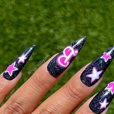 Jeanette Flores on Instagram: "SAVE these Rockstar Barbie nails🎀 SWIPE ➡️ to see the Holo magic!🤩 FOLLOW FOR MORE BARBIE INSPO! Using @daily_charme (code: JEN10) “Abracadabra” holo twinkle gel Tutorial will be up later!😘 #dailycharme #barbie #barbienails #pinknails #barbiepink #stilletonails #summernails #nailitdaily #nailpro #nailartist #pink #hotpinknails #barbiethemovie #holonails #holographicnails #flashnails #barbiecore #barbiestyle #barbiebeauty" Barbie Nails Black And Pink, Goth Barbie Nails, Goth Barbie Makeup, Gothic Barbie Nails, Barbie Doll Nail Art, Goth Pink And Black Nails, Pink Bling Nails, Barbie Nails, Holo Nails