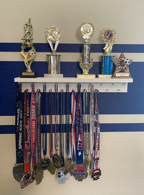 Sports Trophy Display Ideas, Football Medal Display Ideas, Displaying Medals Ideas, Ribbon And Trophy Display Ideas, Medals And Trophy Display Ideas, Soccer Trophy Display Ideas, Trophies Display Ideas, Sports Metal Display Ideas, Award Display Wall Trophy Shelf