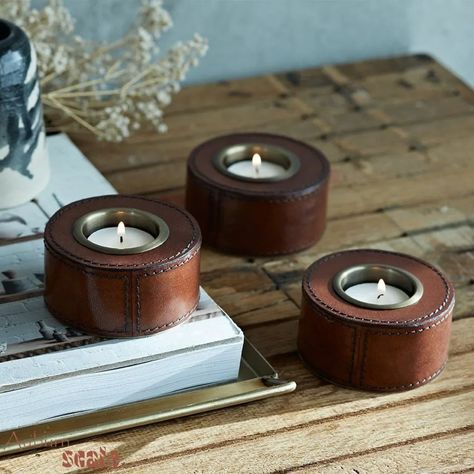 Our round leather candle holders are the perfect blend of understated luxury and charm. They're not something you see every day, but once you do, they captivate. A striking piece that instantly sparks curiosity and admiration. . . . Unveil personalized design solutions and expert guidance by connecting with us at Phone- +91 9810803430 . . #LeatherAccessories #LeatherCandleHolder #HomeDecorInspiration #InteriorDesignTrends #ModernHomeDecor #LuxuryCandleHolder #LeatherHomeDecor #StylishHomeAcce... Leather Candle, Wine Bottle Storage, Leather Coaster, Ottoman Decor, Watch Cufflinks, Leather Storage, Leather Coasters, Bottle Storage, Wool Wrap