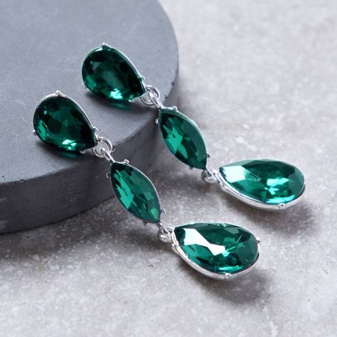 These green triple tear drop crystal earrings are designed with three linked green crystal stones set in a silver colour metal alloy mount.The gorgeous triple teardrop earring are designed in a lovely emerald green colour and are the perfect complement to your special occasion outfit. These earrings ooze sophistication and are perfect for a Ball, special night out, wedding or even a Prom. These drop earrings are approximately 6cm long and 1.5 cm wide.
This set includes a pair of earrings and comes in a gift box.Glass Crystal and Metal Alloynull6cm Drop
1.5cm Width Emerald Green Colour, Occasion Outfit, Special Occasion Outfits, Silver Colour, Crystal Stones, Green Crystal, Green Colour, Green Crystals, Glass Crystal